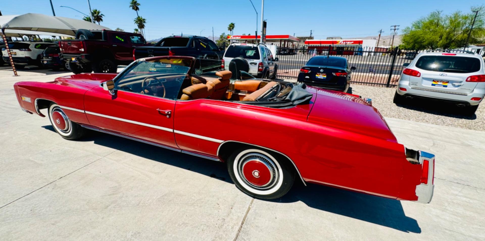 1975 Red Cadillac Eldorado convertible. , located at 2190 Hwy 95, Bullhead City, AZ, 86442, (928) 704-0060, 0.000000, 0.000000 - 1975 Cadillac Eldorado Convertible. Great project car for someone. New tires. Runs and drives, power top works. has a/c doesn't work. needs restoration. interior needs work, engine needs to be serviced . clear title. - Photo#2